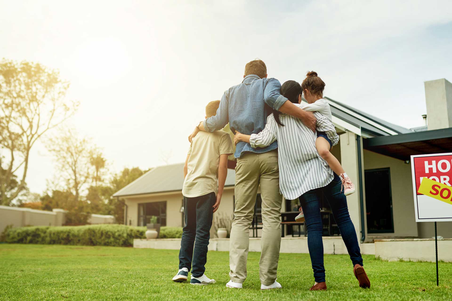 Family celebrating purchase of new home.